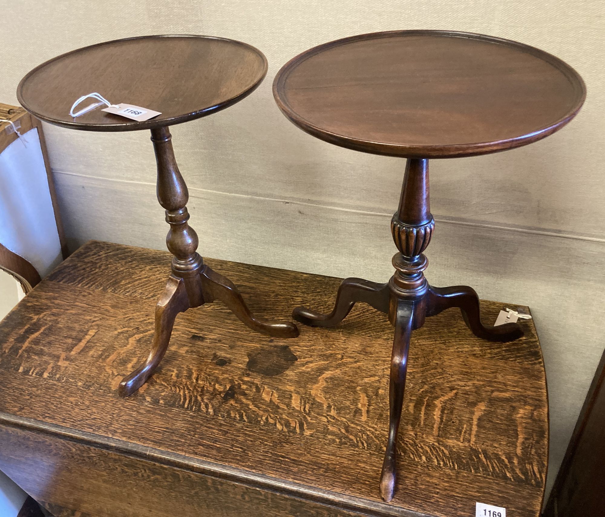 Two reproduction mahogany tripod wine tables, larger 38cm diameter, height 54cm